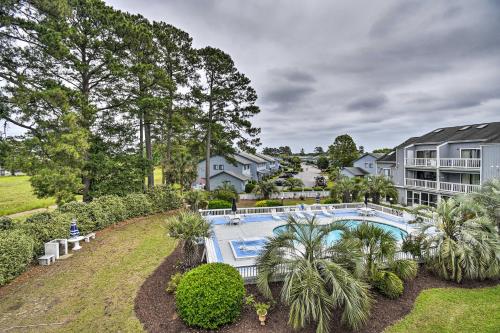 an aerial view of a house with a swimming pool at Baytree Golf Colony Studio about 5 Mi to Beach! in Little River