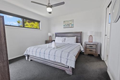 a bedroom with a bed and a window at Elevation in Paynesville