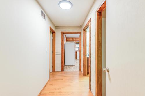 a hallway of a house with a door open at Lakefront Keystone Heights Cottage with Private Dock in Keystone Heights