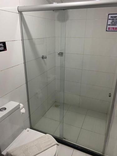 a shower stall in a bathroom with a toilet at Hotel Aliança in Salvador