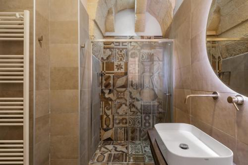 a bathroom with a shower and a toilet and a sink at Vico5 in Lecce