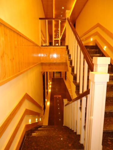a staircase in a building with lights on it at Wonder Hill Kasauli in Kasauli