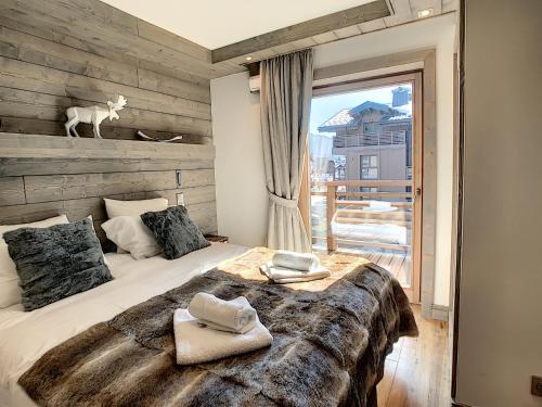 En eller flere senge i et værelse på Annapurna-appartement-6pers-proche centre