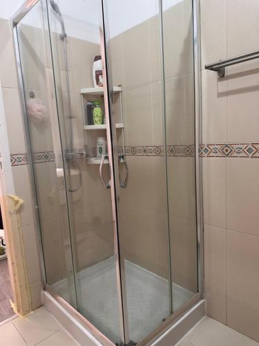 a shower with glass doors in a bathroom at Guest ROOM in Lisbon