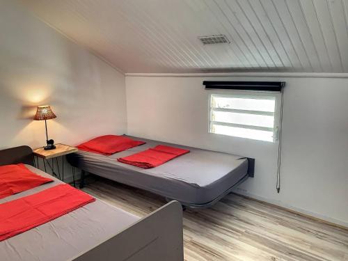 Giường trong phòng chung tại Le Clos de Lafontaine au Marin