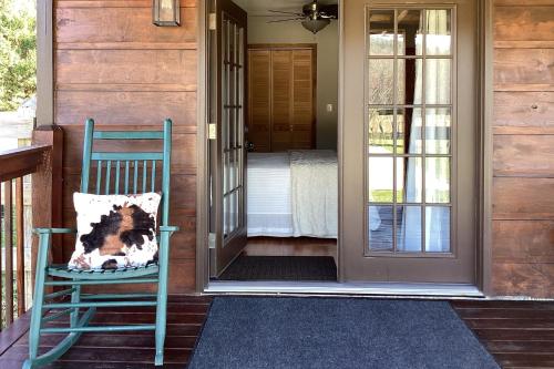 a dog sitting in a chair on a porch at Lil Yellowstone in Morganton