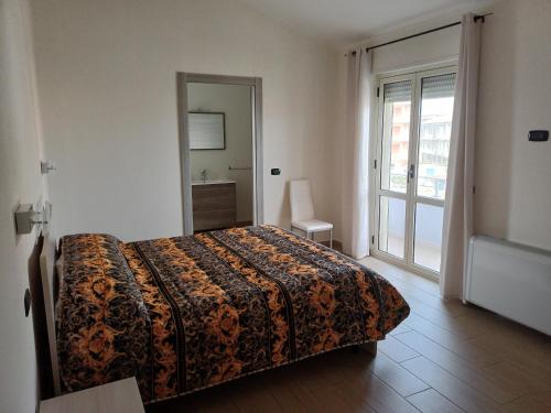 Ένα ή περισσότερα κρεβάτια σε δωμάτιο στο La Magnolia