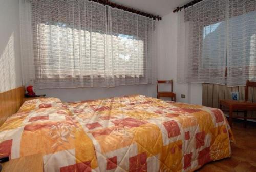 Ένα ή περισσότερα κρεβάτια σε δωμάτιο στο CASA PINUCCIA APPARTAMENTO OVEST