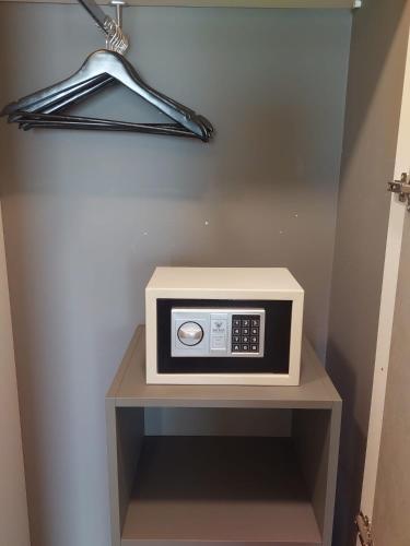 a microwave sitting on a shelf in a room at Hotel Belvedere Resort in Castellammare del Golfo