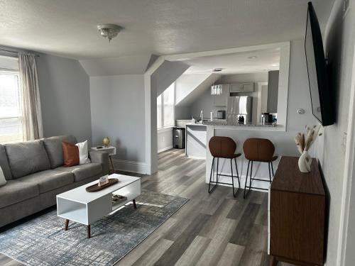 a living room with a couch and a table at Lakeside Haven Oasis (Upper) in Racine