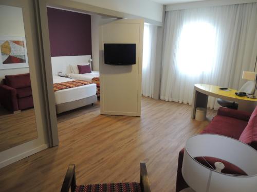 Ένα ή περισσότερα κρεβάτια σε δωμάτιο στο Quality Suites Alphaville