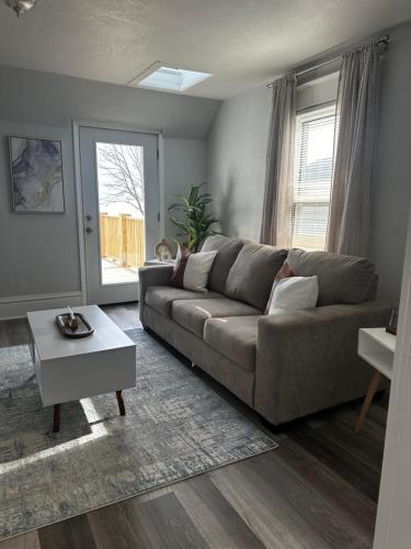 a living room with a couch and a table at Lakeside Haven Oasis (Upper) in Racine