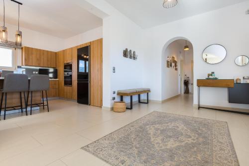 Η κουζίνα ή μικρή κουζίνα στο GREEN IN BLUE RESIDENCE LOGARAS