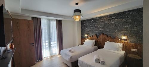 Postel nebo postele na pokoji v ubytování Hotel Ushba in Mestia