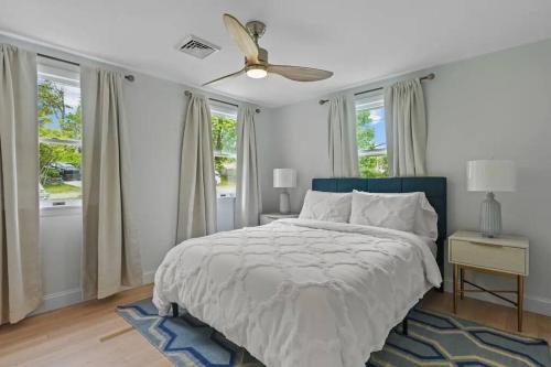 a bedroom with a bed and a ceiling fan at Little Creek Retreat - RIBryan Property in Middletown