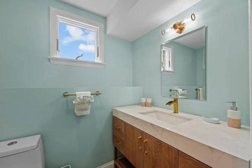 a bathroom with a sink and a mirror at Little Creek Retreat - RIBryan Property in Middletown