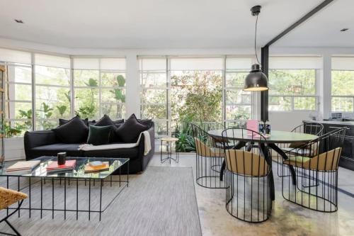 a living room with a couch and a table at Authentic 1BR in Polanco in Mexico City