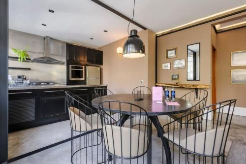 a kitchen and dining room with a table and chairs at Authentic 1BR in Polanco in Mexico City