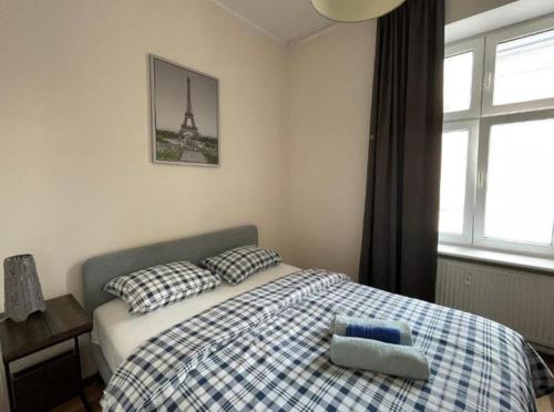 Llit o llits en una habitació de Poznań park