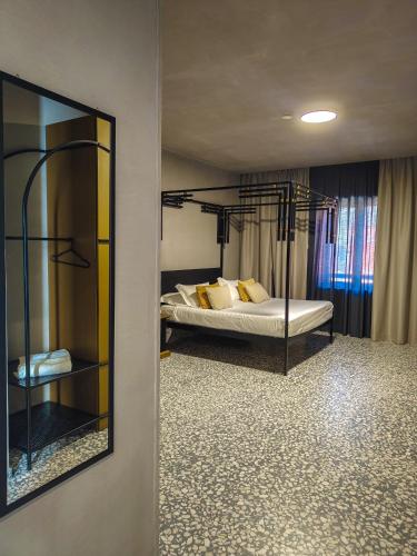 Una cama o camas en una habitación de Hotel Nuvò