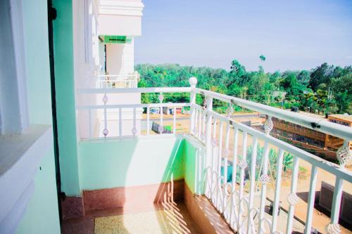 a balcony with a view of a park at Arctic tern homes in Embu