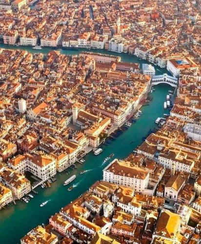 an aerial view of a city with a harbor at Hotel New Aurora Venice in Marghera