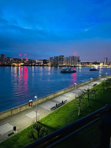 a view of a river with a boat in the water at Room in a Shared Flat, E16 in London