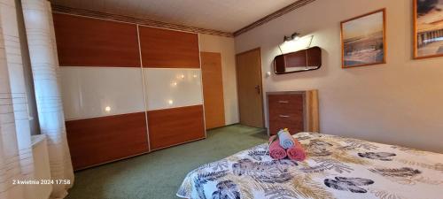 Ένα ή περισσότερα κρεβάτια σε δωμάτιο στο PROMYK - Apartamenty & Pokoje - dla dorosłych