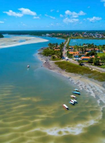 an aerial view of a beach with boats in the water at Casa ampla na Praia do Atalaia Salinas Pará in Salinópolis