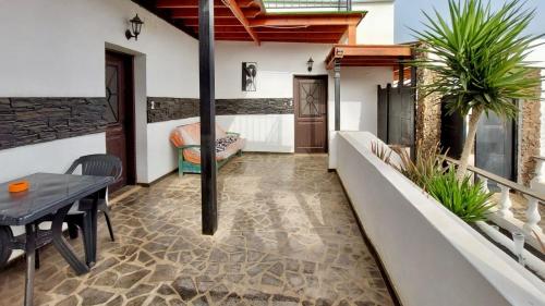 a living room with a table and a couch at Lanzarote Hostel in Arrecife