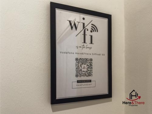 a picture of a sign on a wall at Comfort Suite - Airport 5min - AC - Smart TV in Genova