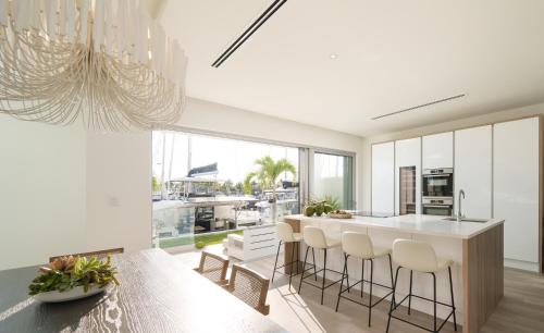 a kitchen with a island with bar stools at Palm Cay Marina and Resort in Nassau