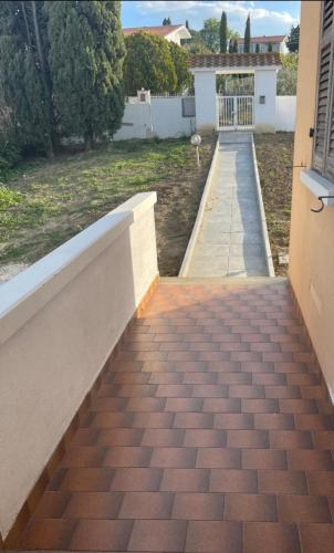 a walkway leading up to a house at B&B Villa Alma in San Costanzo