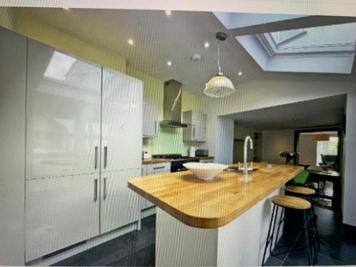 a kitchen with a wooden counter top in a room at Captains No9 Falmouth in Falmouth