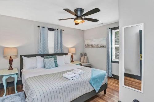 a bedroom with a bed with a ceiling fan at Homey 4BR in Earlewood in Columbia