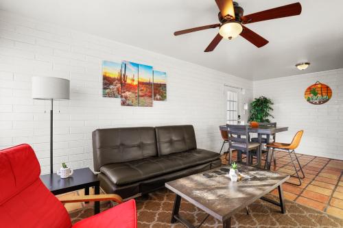 a living room with a couch and a table at Pinchot Dos - Old Town Scottsdale in Scottsdale