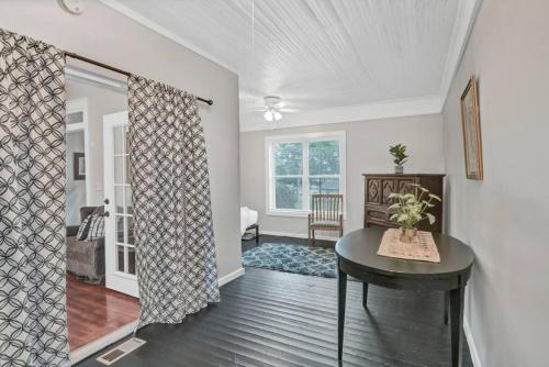 a living room with a table and a window at Spacious 5BR - Pet Friendly in Columbia