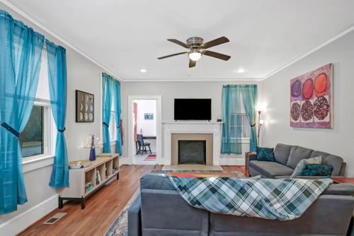 a living room with a couch and a tv at Unique 3BR - Sleeps 6 in Columbia