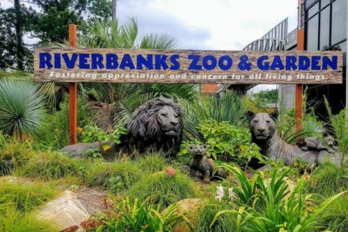 a sign for the riverbend lions zoo and garden at Urban Farmhouse-Sleeps 8 in West Columbia