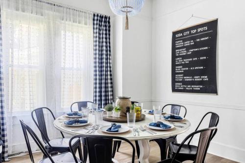 a dining room with a table and chairs at Urban Farmhouse-Sleeps 8 in West Columbia
