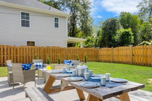 a wooden table with blue and white dishes on it at Urban Farmhouse-Sleeps 8 in West Columbia