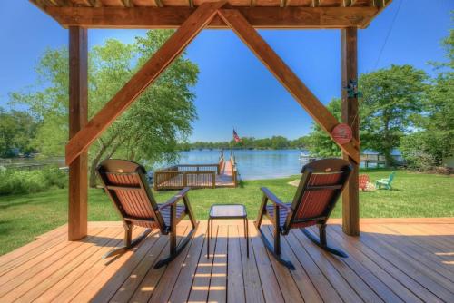 a gazebo with two chairs and a table at Luxurious Stay on Lake Murray in Lake Murray Shores