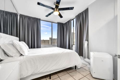 a bedroom with a bed and a ceiling fan at Beautiful space in Heart of Downtown ATL (Atlanta) in Atlanta