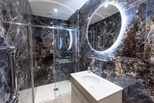 a bathroom with a sink and a mirror at The Resolution Hotel in Whitby