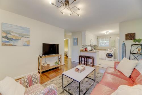 a living room with a couch and a table at Comfy and Convenient Condo in Columbia