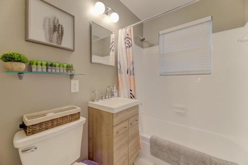 a bathroom with a toilet and a sink at Modern Renovated Apartment in Columbia