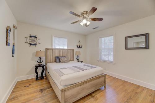 a bedroom with a bed and a ceiling fan at Carolina Crash Pad Upstairs in Columbia