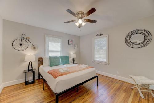a bedroom with a bed and a ceiling fan at Carolina Crash Pad Downstairs in Columbia