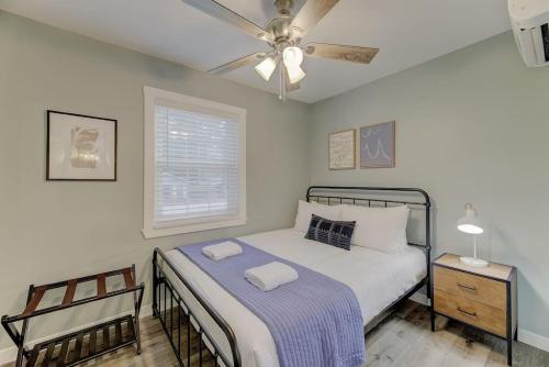 a bedroom with a bed and a ceiling fan at Ft. Jackson Family Abode in Columbia