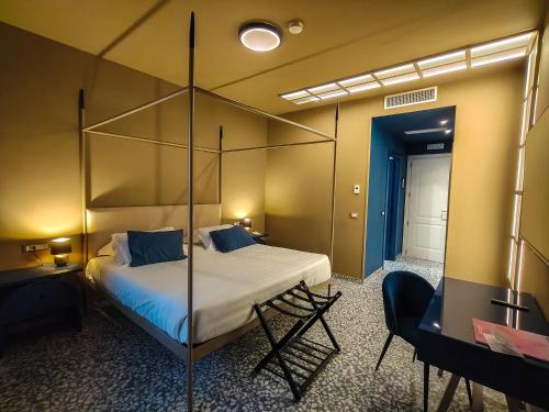 Una cama o camas en una habitación de Hotel Nuvò